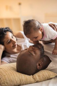 Parents spending time with their infant child